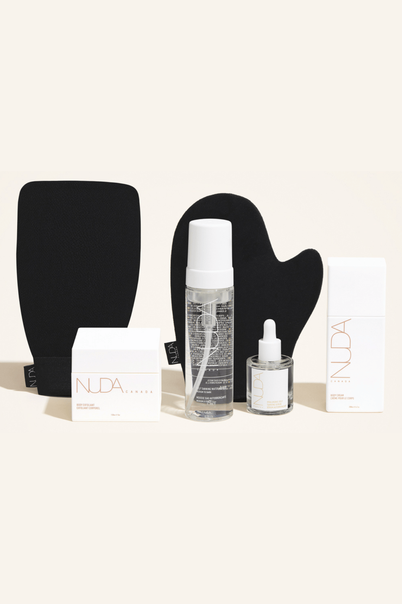 Deluxe Routine Kit featuring exfoliating mitt, self tanning mousse, face tanner, and body cream for a customizable glow.