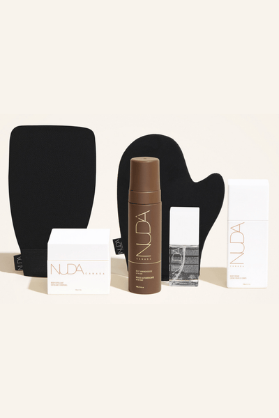 Deluxe Routine Kit featuring self tanning mousse, exfoliating mitt, and body cream for a radiant tan.