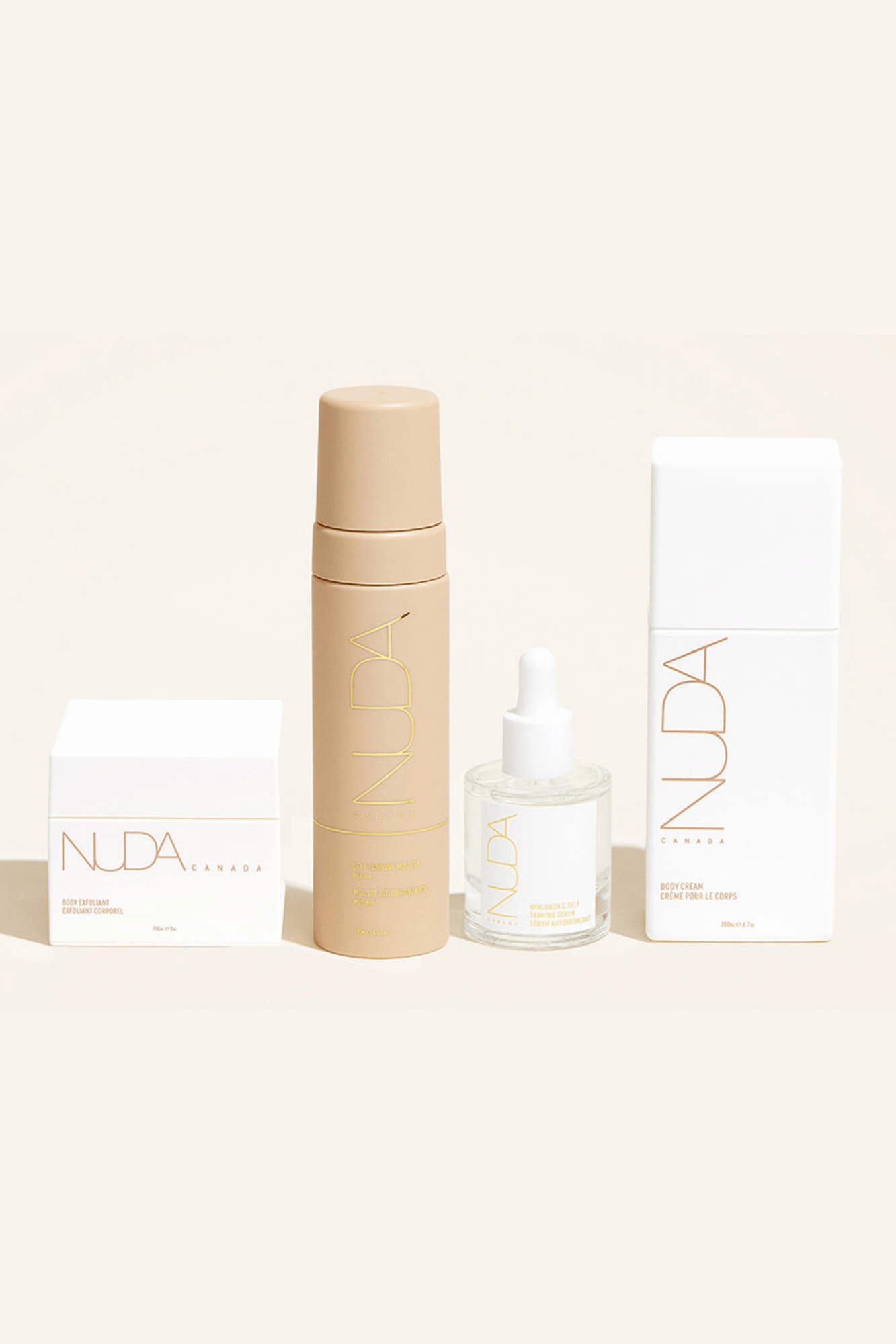 Nuda Routine Kit featuring Self Tanning Mousse, Body Exfoliant, Face Tanner, and Body Cream for a flawless glow.
