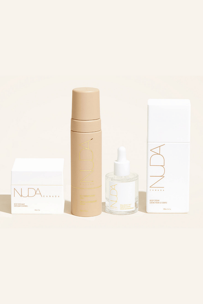 Nuda Routine Kit featuring Self Tanning Mousse, Body Exfoliant, Face Tanner, and Body Cream for a flawless glow.