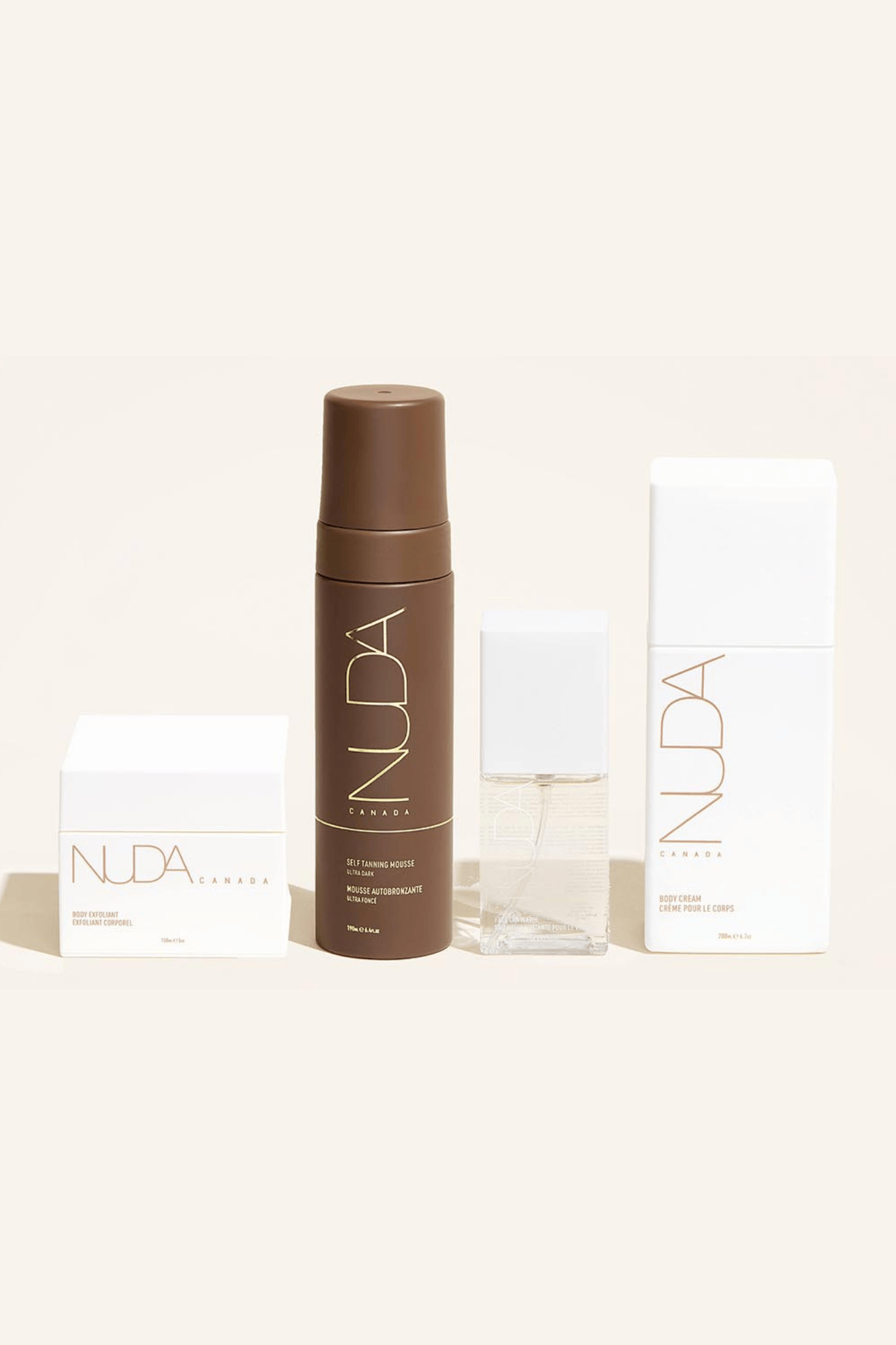 Nuda Routine Kit featuring Body Exfoliant, Self Tanning Mousse, face tanner, and Body Cream for a customizable tan.