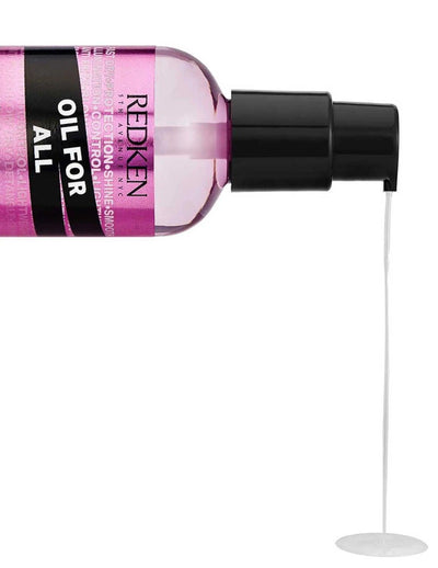 Redken Oil For All hair oil bottle with product dispensing, nourishing all hair types for shine and manageability.