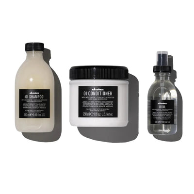 Davines OI Traditional Gift Set featuring OI Shampoo, OI Conditioner, and OI Oil for soft, shiny hair.