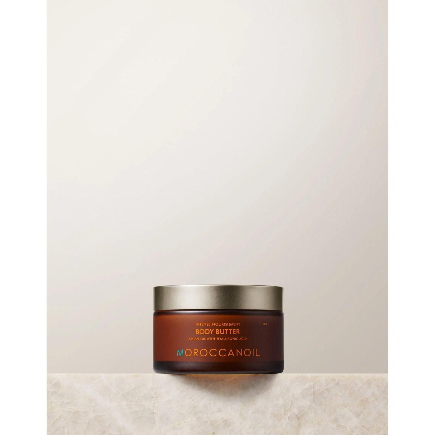 Original Body Butter Lotion by Moroccanoil in a jar, showcasing its rich moisturizer for dry skin.