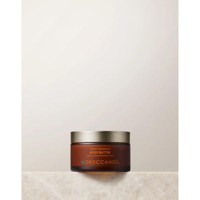Original Body Butter Lotion by Moroccanoil in a jar, showcasing its rich moisturizer for dry skin.