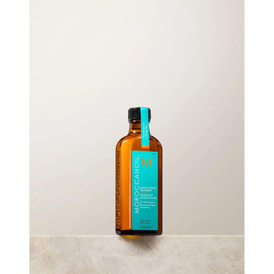 Moroccan Oil Original Hair Treatment bottle, featuring argan oil for smooth, silky hair and split end repair.