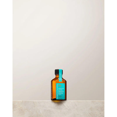 Moroccan Oil Original Hair Treatment bottle on a minimalist background, ideal for smooth and silky hair.
