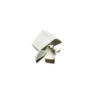 Broken pieces of Originale Fragrance Soap Bar showcasing its smooth texture and creamy color.