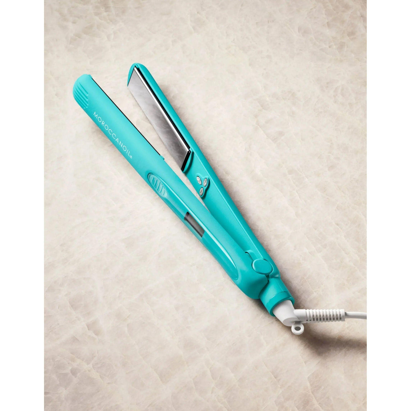 Turquoise flat iron with titanium plates, designed for quick, even heating and effortless styling.