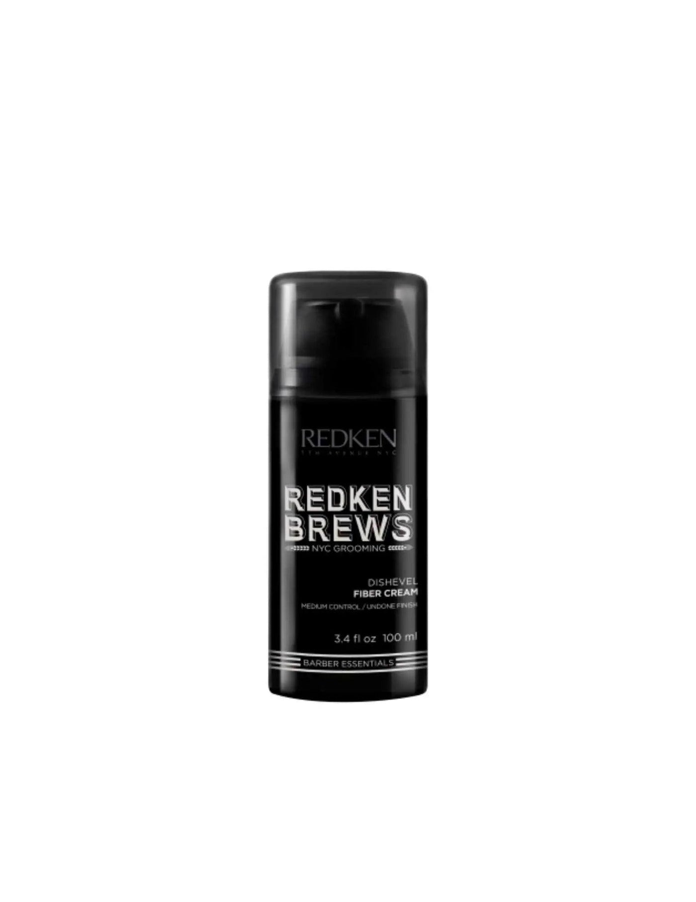 Redken Brews Dishevel Fiber Cream styling product in a sleek black bottle for textured, natural hairstyles.
