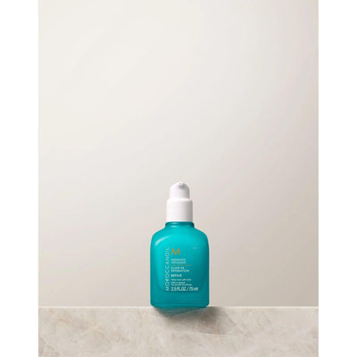 Moroccanoil's Mending Infusion styling product in a turquoise bottle on a light background.