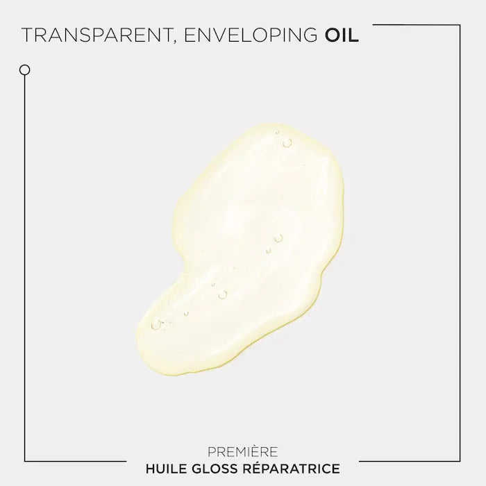 Transparent enveloping oil for hair, showcasing the Première repairing high shine treatment for damaged hair.