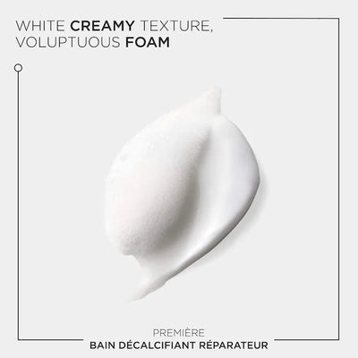 White creamy foam texture of Bain Décalcifiant Réparateur Shampoo for damaged hair care.