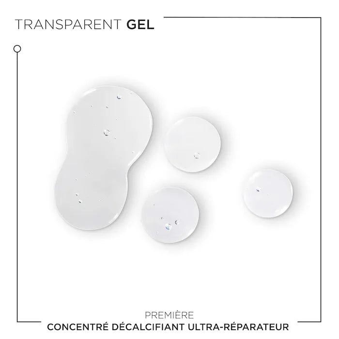 Transparent gel drops of Concentré Ultra-Réparateur for damaged hair treatment.