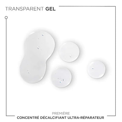 Transparent gel drops of Concentré Ultra-Réparateur for damaged hair treatment.