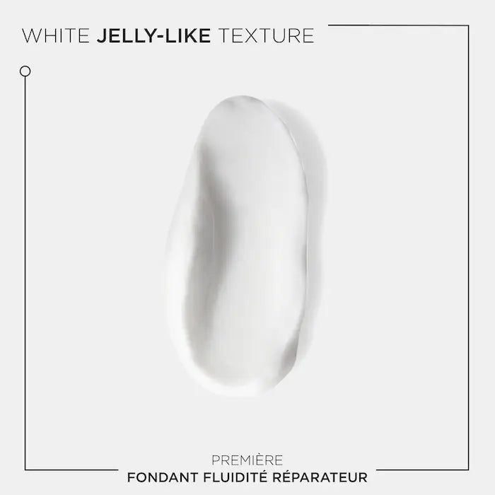Kérastase Fondant Fluidité Réparateur conditioner showing a white jelly-like texture for damaged hair restoration.