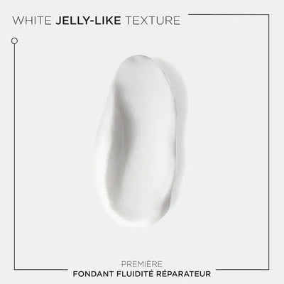 Kérastase Fondant Fluidité Réparateur conditioner showing a white jelly-like texture for damaged hair restoration.