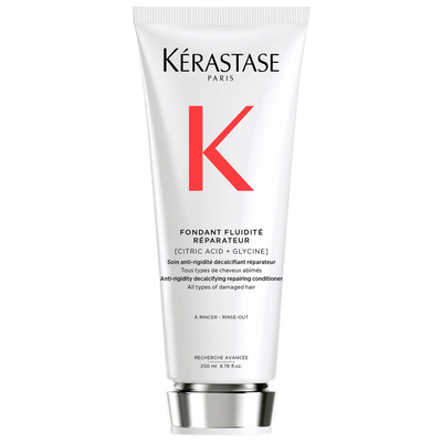 Kérastase Fondant Fluidité Réparateur Conditioner tube for damaged hair with decalcifying properties, 200ml size.
