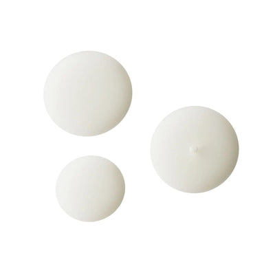 Three circular white cosmetic product containers for skincare, suitable for any beauty routine.