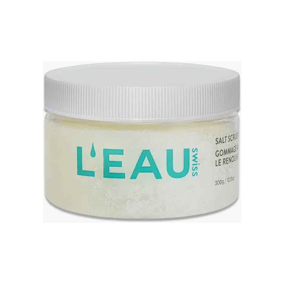 L'Eau Swiss Skin Renewal Salt Scrub in a clear jar with a white lid, promoting smooth and rejuvenated skin.