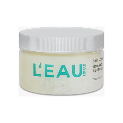 L'Eau Swiss Skin Renewal Salt Scrub in a clear jar with a white lid, promoting smooth and rejuvenated skin.