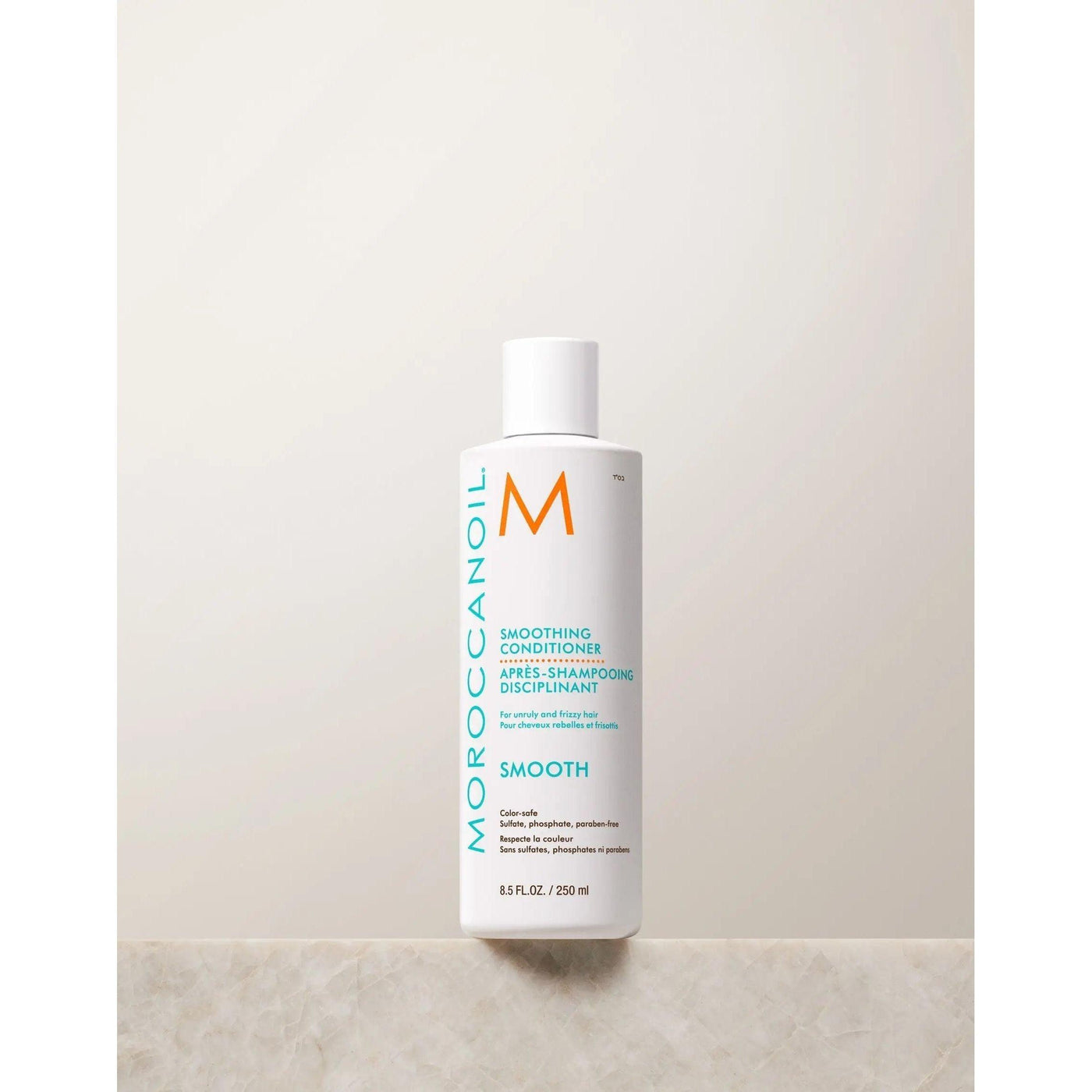Moroccanoil Smoothing Conditioner bottle designed to tame frizz and enhance hair's natural shine and softness.