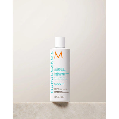 Moroccanoil Smoothing Conditioner bottle designed to tame frizz and enhance hair's natural shine and softness.