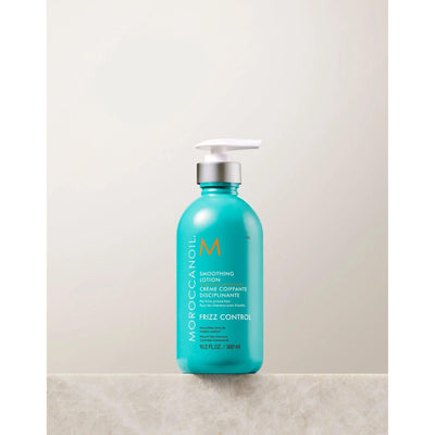 Moroccanoil Smoothing Lotion bottle for frizz control and smooth, manageable hair, 12.7 fl oz.