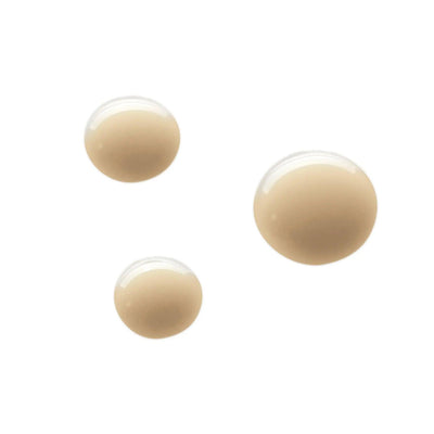 Three drops of beige skincare serum highlighting its smooth texture and rich formula for blemish treatment.