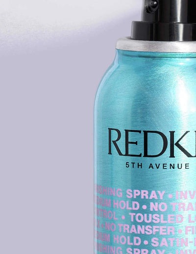 Redken Spray Wax for versatile styling, offering flexible hold and natural finish for all hair types and textures.