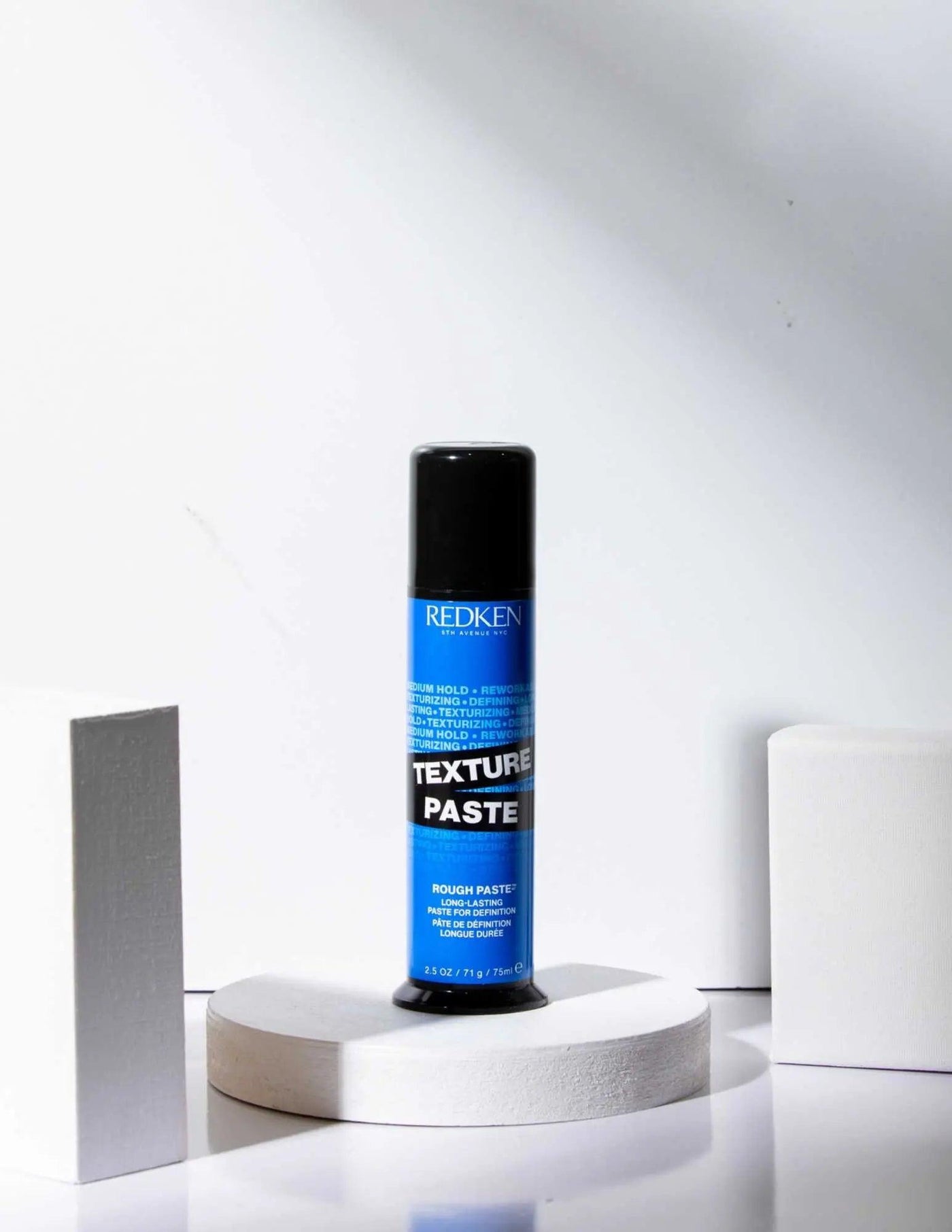 Redken Texture Paste for versatile styling, providing texture and flexible hold for all hair types and textures.