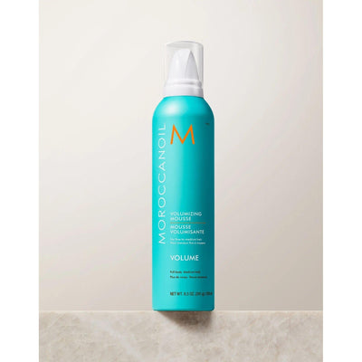 Moroccanoil Volumizing Mousse for medium to fine hair, providing lift and body without stickiness.