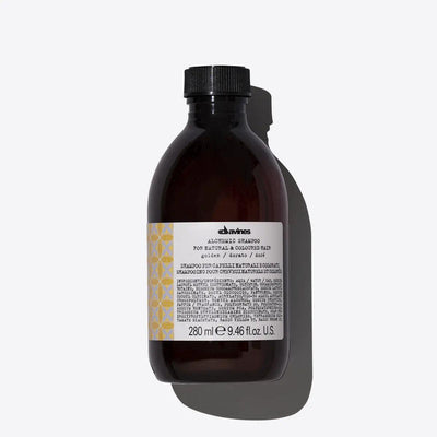 Davines Alchemic Shampoo Golden bottle for enhancing blonde tones, 280 ml, perfect for illuminating honey-blonde shades.