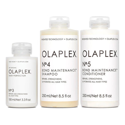 Olaplex Bond Maintenance System Kit featuring No.3 Hair Perfector, No.4 Shampoo, and No.5 Conditioner for all hair types.
