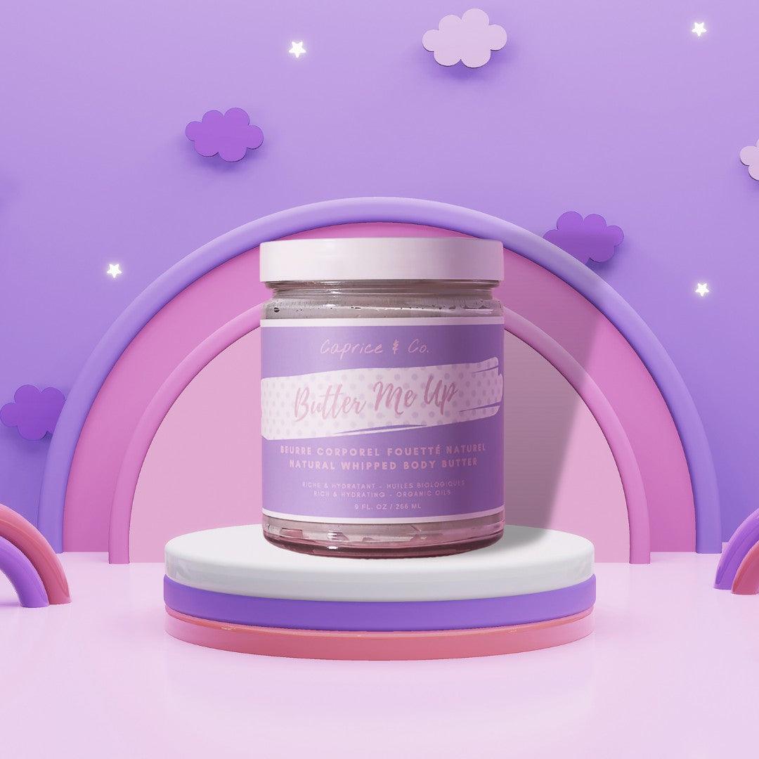 Butter Me Up bubblegum-scented whipped body butter in a jar against a whimsical pastel background.