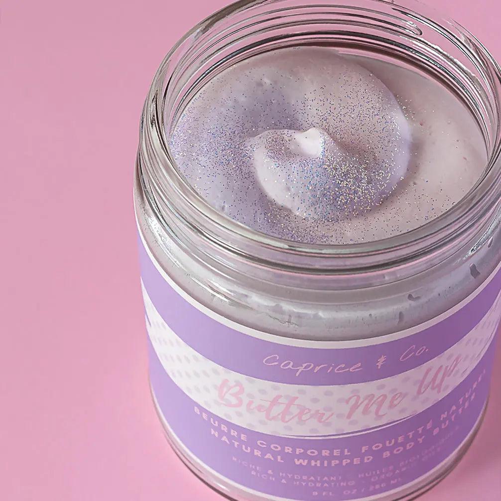 Natural whipped body butter "Butter Me Up" in a jar, showcasing a shimmering bubblegum scent texture.