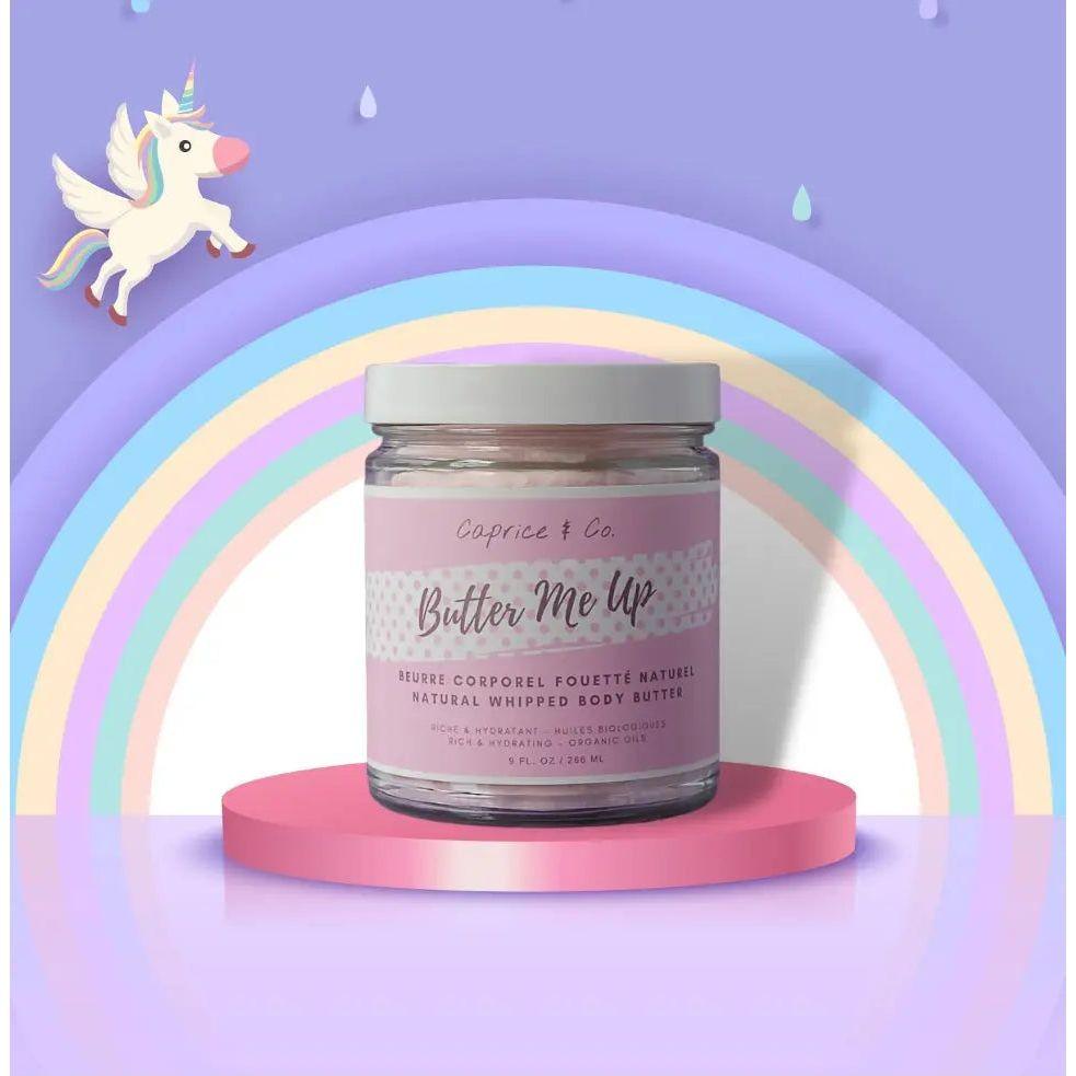 Butter Me Up natural whipped body butter in a jar with colorful rainbow background and unicorn, offering smooth hydration.