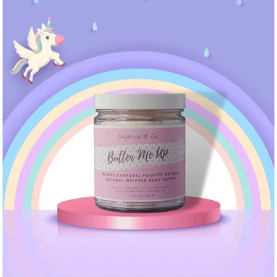 Butter Me Up natural whipped body butter in a jar with colorful rainbow background and unicorn, offering smooth hydration.
