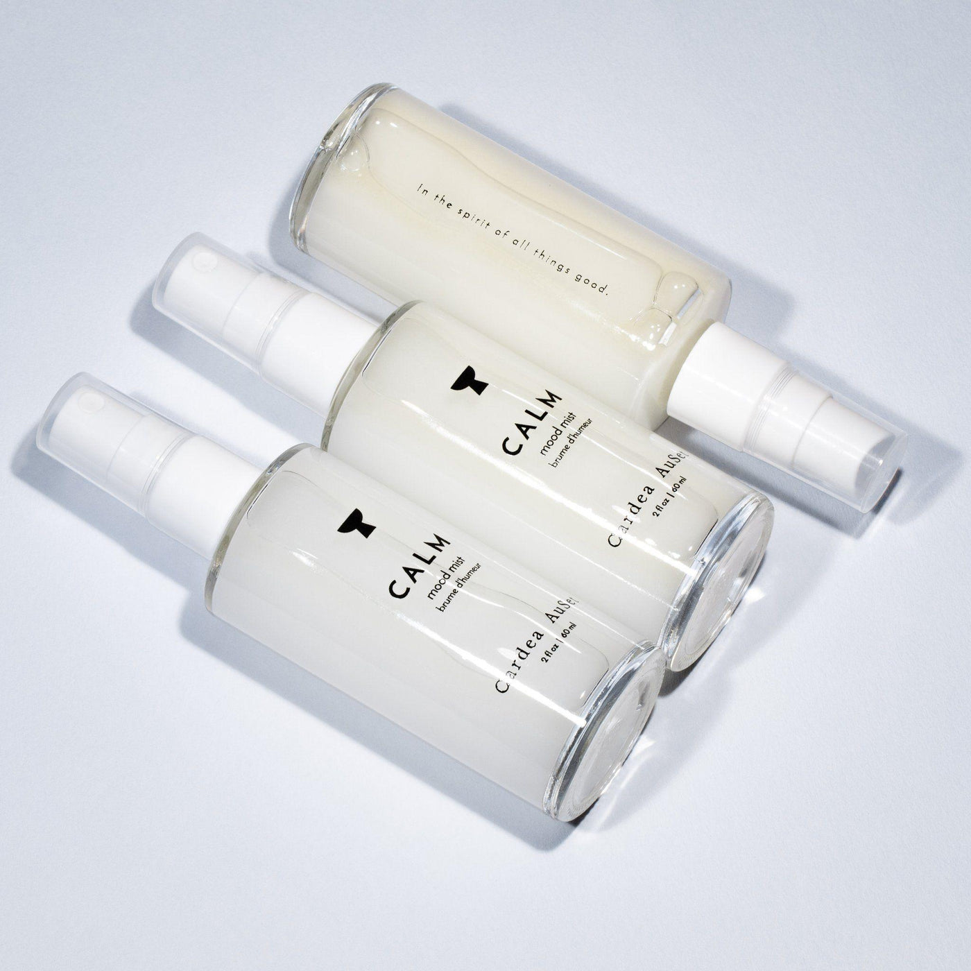 3 skincare spray bottles labeled Calm on light background; calm skin spray for soothing and hydrating face.