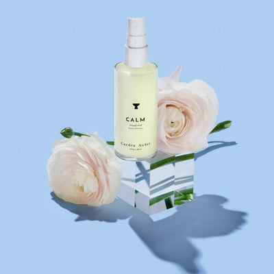 Luxurious floral facial mist with calming properties, featuring roses and minimal design, perfect for soothing and refreshing skin.