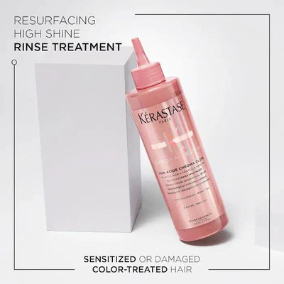 Kérastase Paris resurfacing high shine rinse treatment for sensitized or damaged color-treated hair in pink bottle.