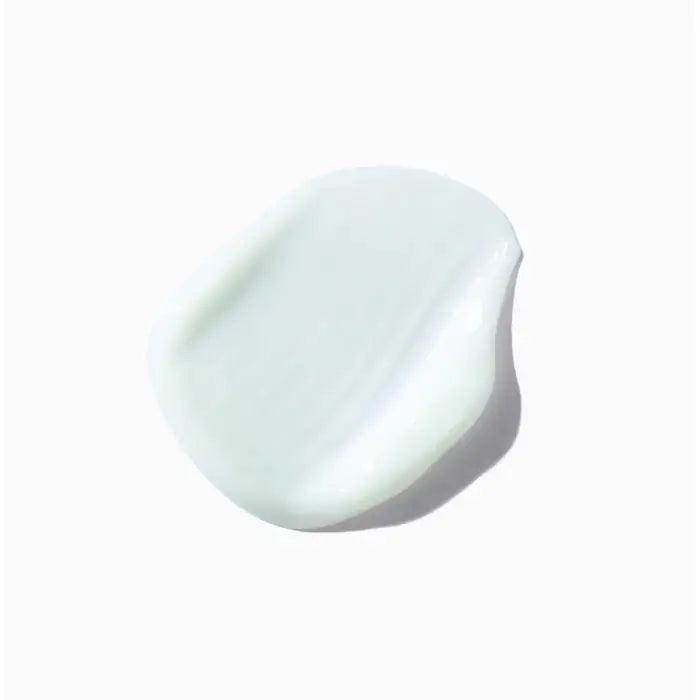 Smooth white cream swatch on a white background for skincare and beauty products.