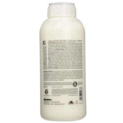 Back view of Davines Love Curl Pro Shampoo bottle, showcasing product details and ingredients for curly hair care.