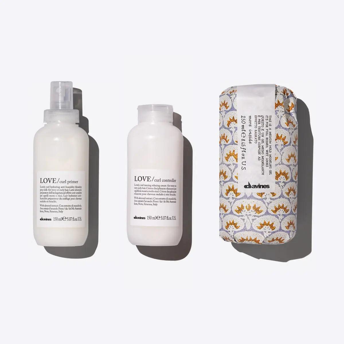 Davines Defined Coils Set featuring Love Curl Primer, Love Curl Controller, and Medium Hold Modeling Gel for defined curls.