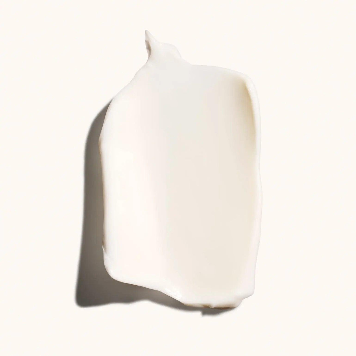 Smooth swatch of Desertland Restorative Body Crème showcasing its rich, creamy texture.