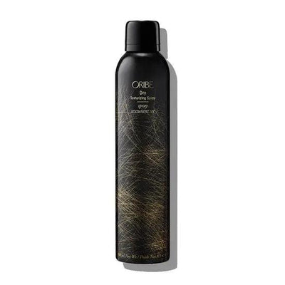 Oribe Dry Texturizing Spray black bottle for hair volume and texture styling.
