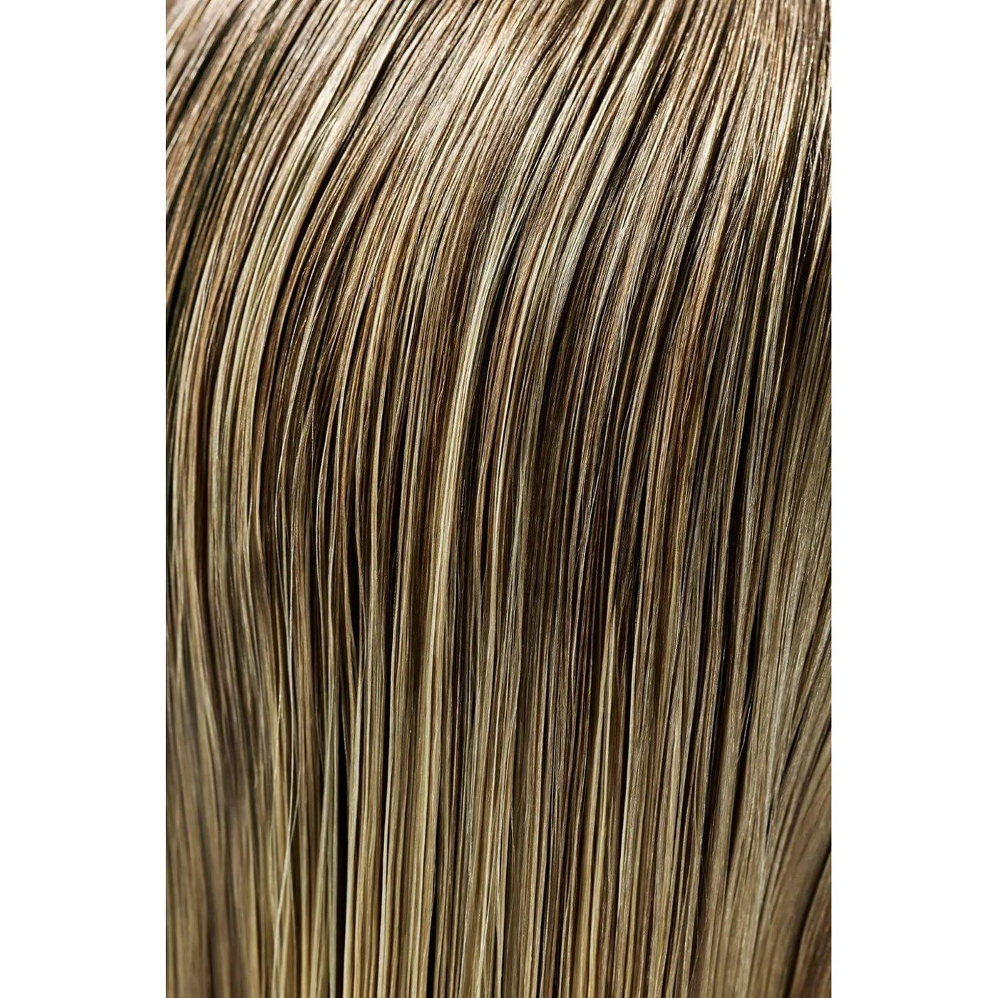 Close-up of smooth, shiny, straight light brown hair with blonde highlights, showing healthy and well-maintained strands.