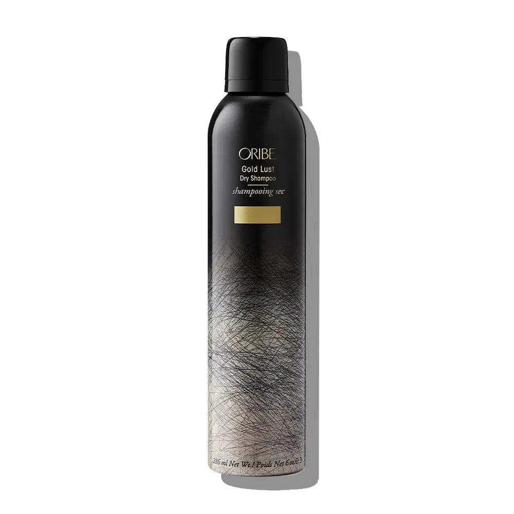 Oribe Gold Lust Dry Shampoo spray bottle against white background