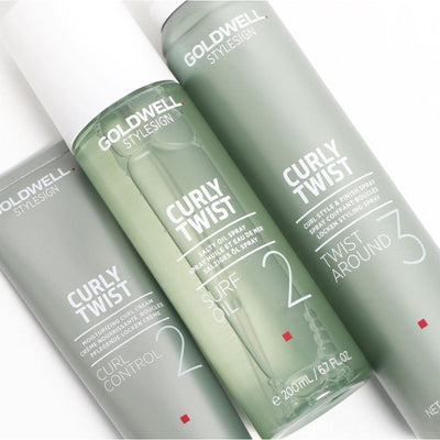 Goldwell Curly Twist styling products including Curl Control, Surf Oil, and Twist Around for defined, nourished curls.