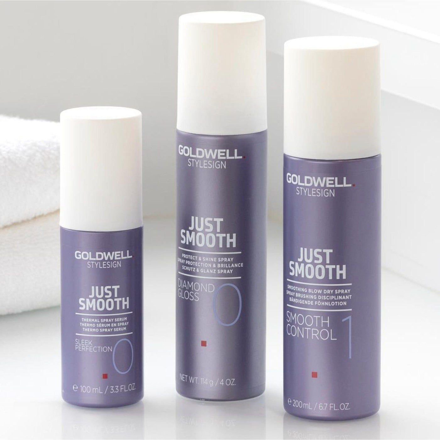 Goldwell Just Smooth hair products for heat protection and shine, including Thermal Spray Serum and Smooth Control Spray.